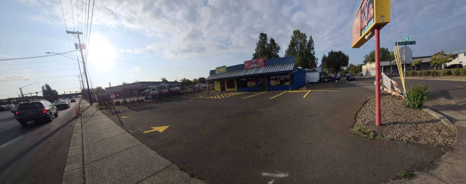 Completed directional arrows and parking lines across a commercial lot
